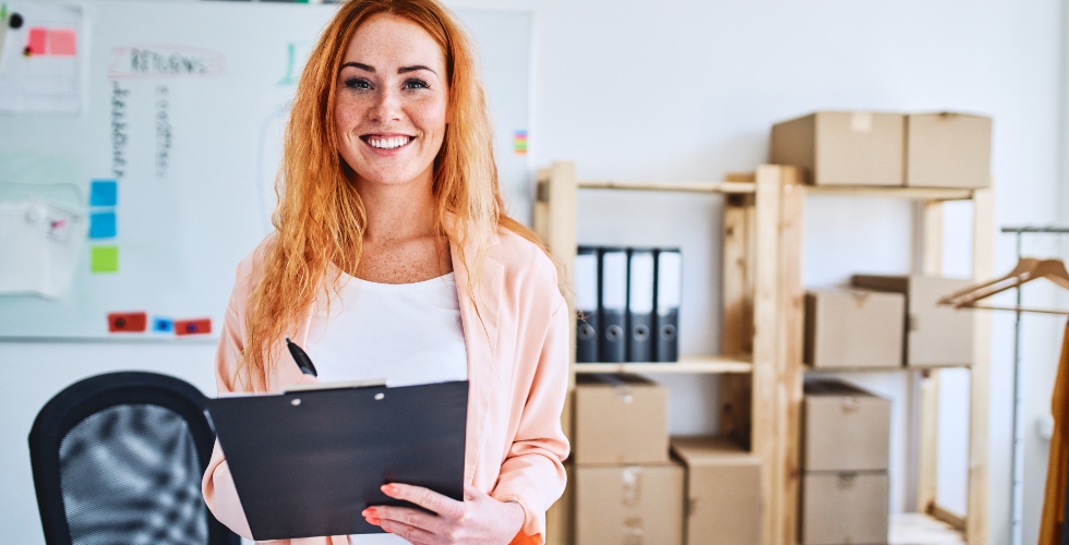 young business woman with clipboard in hand